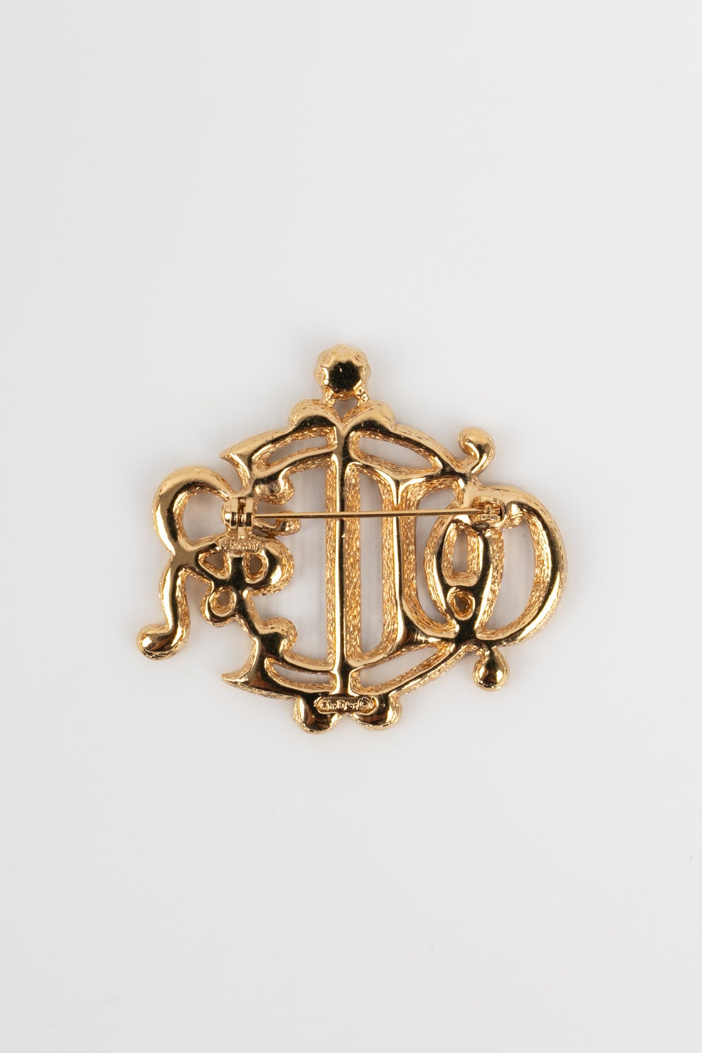 Broche dorée Dior